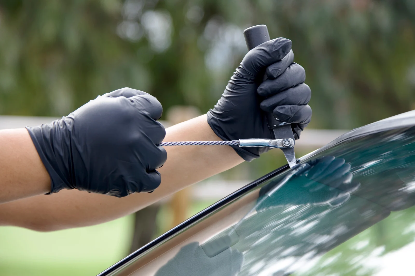 Technician installing a replacement windshield