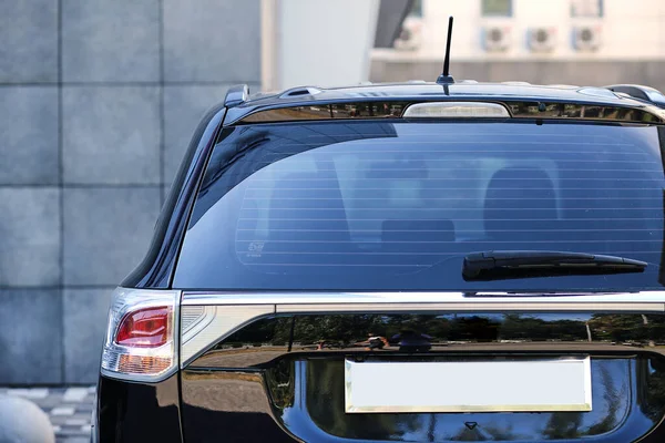 Auto glass repair on a sedan